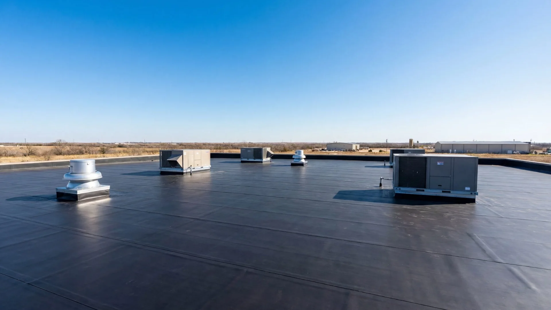 Black EPDM rubber membrane on a flat roof in Rochester, NY
