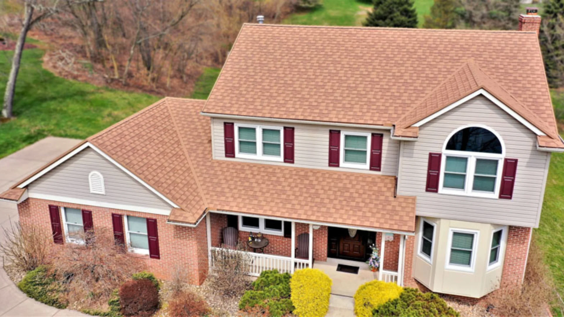 Completed asphalt shingle roof replacement on a home in Rochester, NY